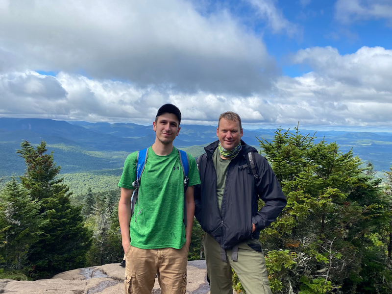 Dylan LaFave (left) and David Theobald (right) standing at the summit of Cascade mountain.
